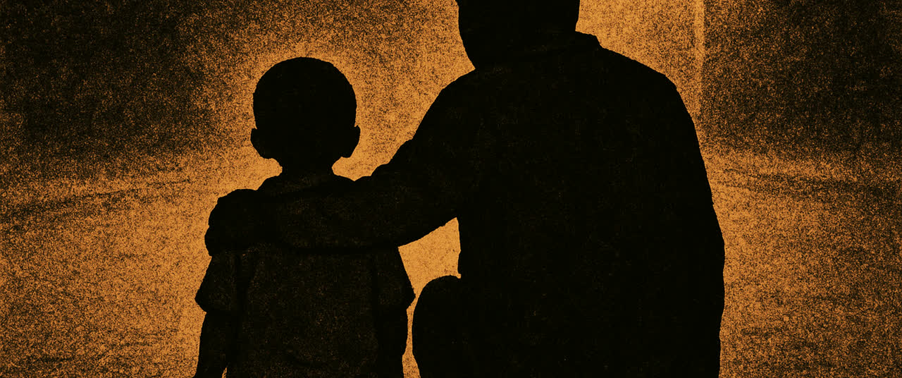 Reconstruction frame D2: A small child seated on a kerb at night seen entirely from behind, an adult's arm across t